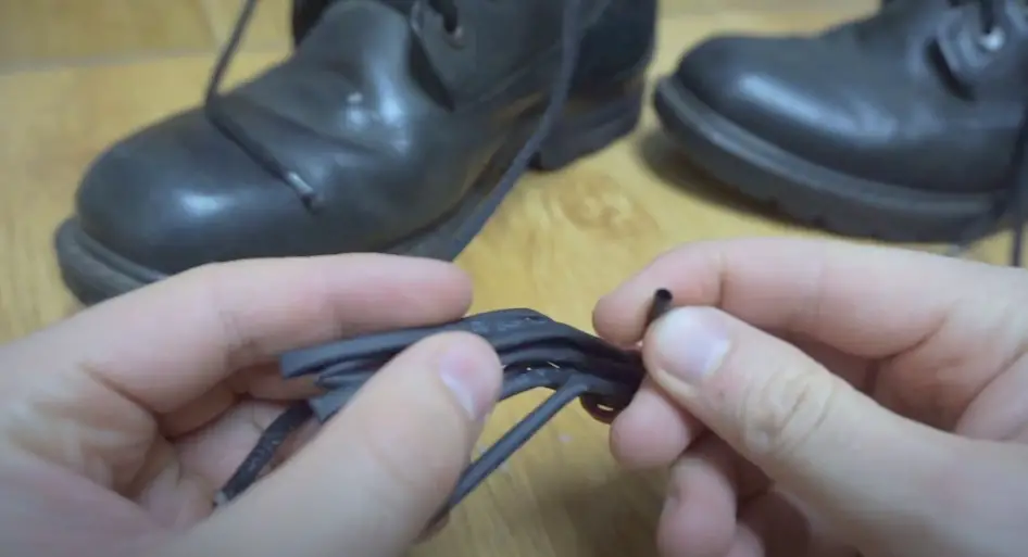 fixing shoelace with shrink tube