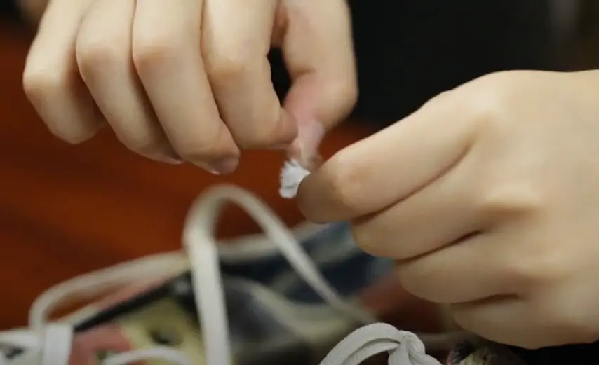 repair aglet using sticky tape